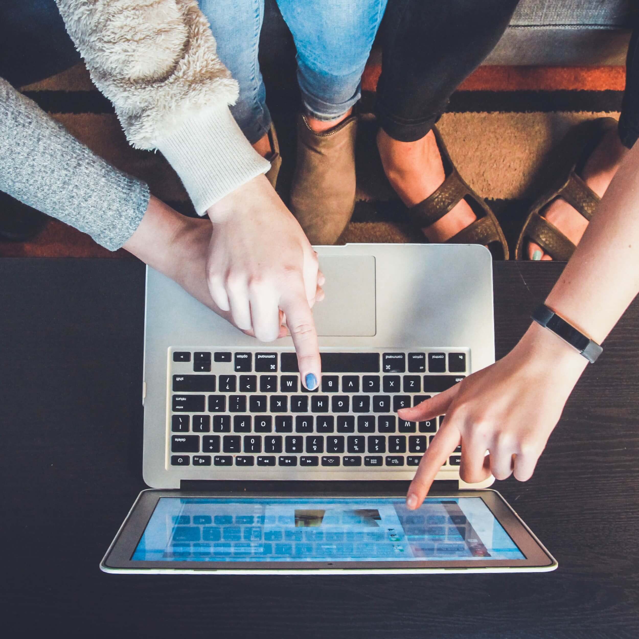 people looking at their new website on a laptop